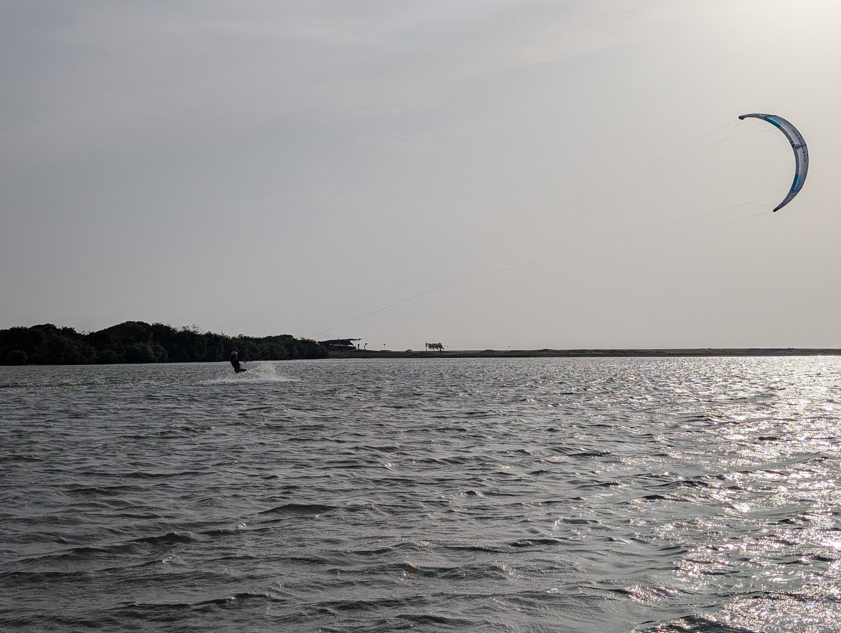 A kitesurfer on the flat water of the Kappalady lagoon